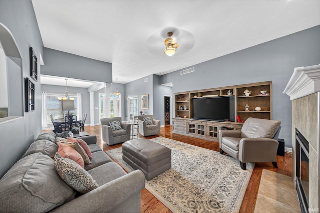 51733 Copperfield Rdg, Granger, IN 46530 - living area with a fireplace with flush hearth and wood finished floors