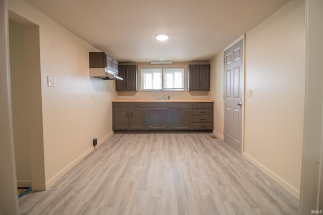 827 W Elm St, Union City, IN 47390 - kitchen with light wood finished floors, light countertops, and dark brown cabinets