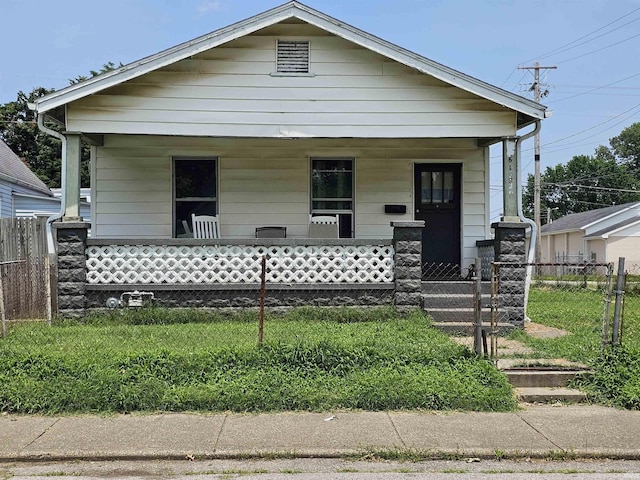618E Missouri St, Evansville, IN 47711 - view of front of home with a porch and a fenced front yard