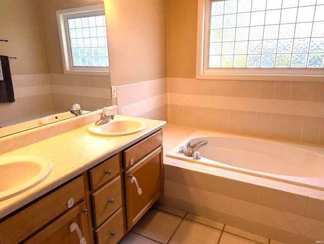 2220 Bobolink Dr, West Lafayette, IN 47906 - bathroom featuring plenty of natural light, a bath, double vanity, and tile patterned flooring
