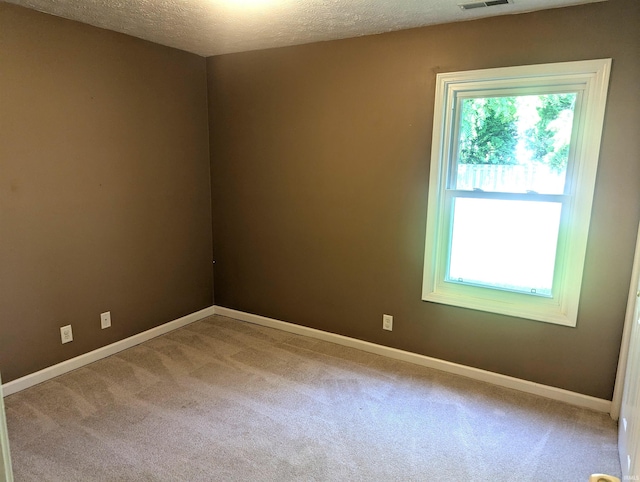 2220 Bobolink Dr, West Lafayette, IN 47906 - carpeted spare room featuring baseboards and a textured ceiling