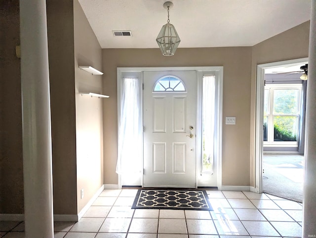 2220 Bobolink Dr, West Lafayette, IN 47906 - entryway featuring light tile patterned flooring and baseboards