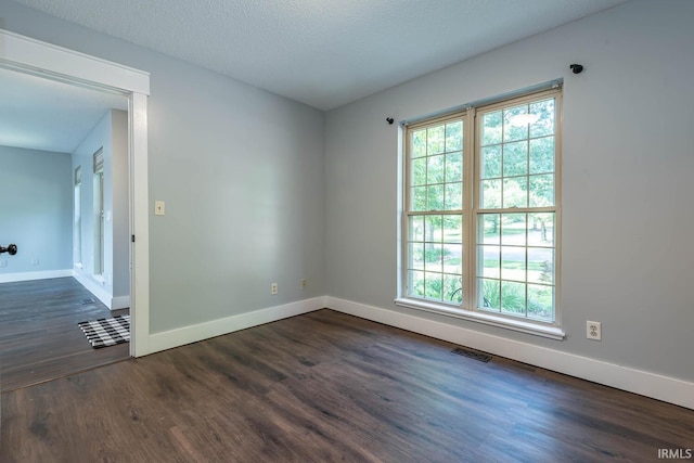 3523 S Tulip Ave, Bloomington, IN 47403 - unfurnished room featuring dark wood finished floors and baseboards