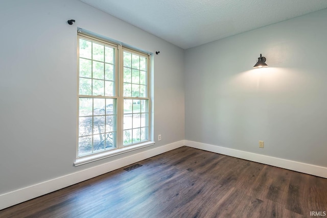 3523 S Tulip Ave, Bloomington, IN 47403 - empty room featuring baseboards and dark wood-type flooring