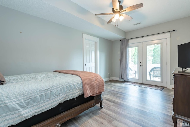3523 S Tulip Ave, Bloomington, IN 47403 - bedroom featuring access to exterior, french doors, light wood-style floors, and a ceiling fan