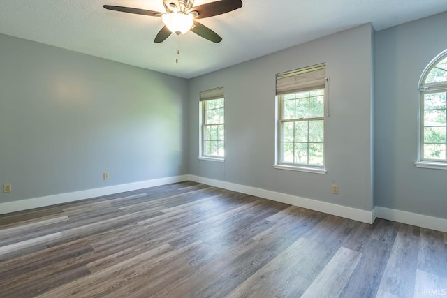 3523 S Tulip Ave, Bloomington, IN 47403 - empty room featuring a ceiling fan and wood finished floors