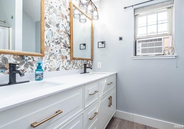 3523 S Tulip Ave, Bloomington, IN 47403 - bathroom with double vanity, cooling unit, and wood finished floors