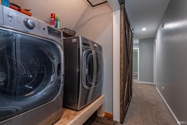 3523 S Tulip Ave, Bloomington, IN 47403 - laundry room featuring independent washer and dryer, a textured ceiling, carpet floors, and a barn door