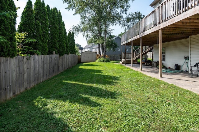 3523 S Tulip Ave, Bloomington, IN 47403 - fenced backyard featuring a shed, a patio, stairs, and a deck