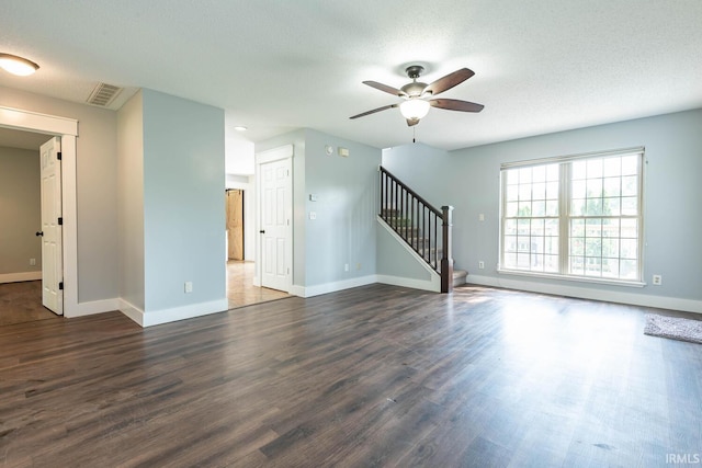 3523 S Tulip Ave, Bloomington, IN 47403 - unfurnished living room with stairway, ceiling fan, dark wood-style flooring, and a textured ceiling