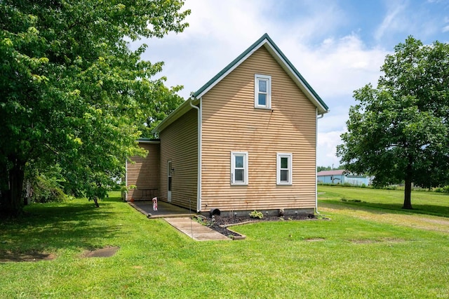 315 Mill St, Geneva, IN 46740 - rear view of house featuring a lawn
