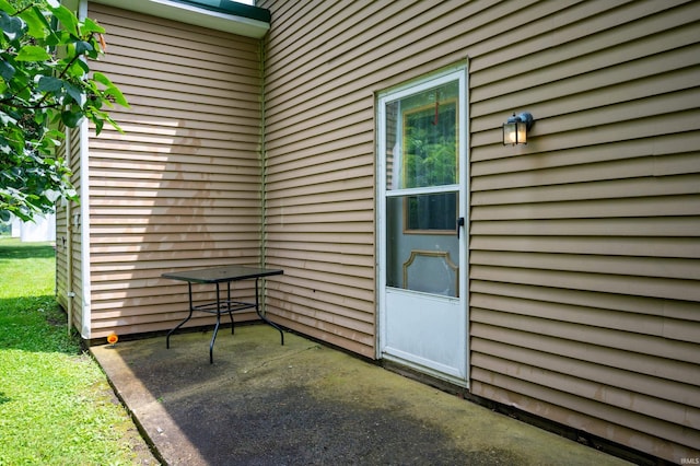 315 Mill St, Geneva, IN 46740 - doorway to property with a patio