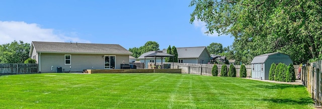 54410 Pleasant Valley Dr, Osceola, IN 46561 - back of house featuring a storage shed, a gazebo, and a fenced backyard