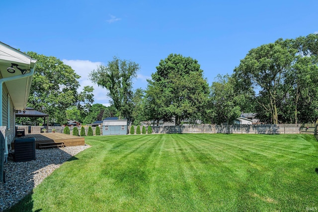 54410 Pleasant Valley Dr, Osceola, IN 46561 - view of yard with a wooden deck and a storage shed