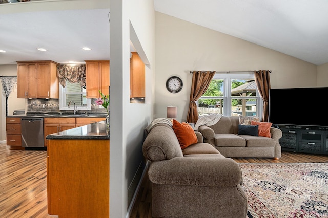 54410 Pleasant Valley Dr, Osceola, IN 46561 - living area featuring light wood-type flooring, recessed lighting, and high vaulted ceiling