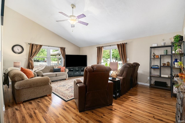 54410 Pleasant Valley Dr, Osceola, IN 46561 - living area with wood finished floors, ceiling fan, and high vaulted ceiling