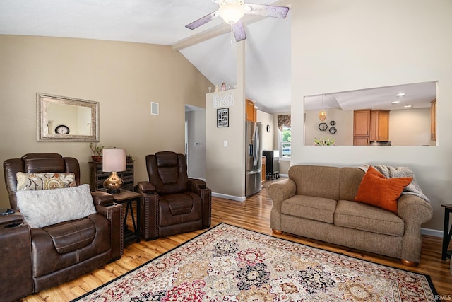 54410 Pleasant Valley Dr, Osceola, IN 46561 - living area featuring light wood-style flooring, a ceiling fan, beam ceiling, and high vaulted ceiling