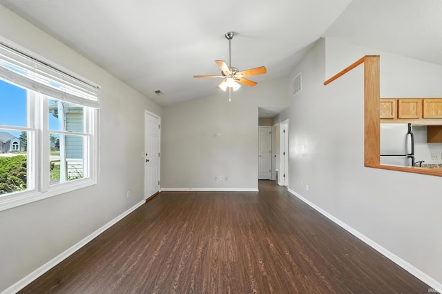 806 Deer Ridge Xing, Auburn, IN 46706 - unfurnished living room featuring wood finished floors, lofted ceiling, and a ceiling fan