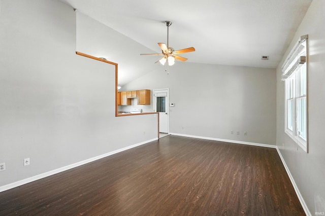 806 Deer Ridge Xing, Auburn, IN 46706 - unfurnished living room featuring a ceiling fan, dark wood finished floors, and vaulted ceiling