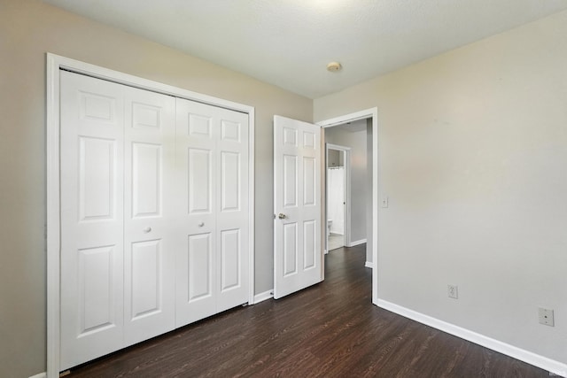 806 Deer Ridge Xing, Auburn, IN 46706 - unfurnished bedroom with dark wood finished floors and a closet