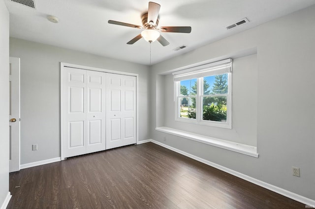 806 Deer Ridge Xing, Auburn, IN 46706 - unfurnished bedroom with dark wood finished floors, a closet, and a ceiling fan