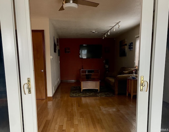 1074 Chapman Lake Dr, Warsaw, IN 46582 - hall with light wood-style flooring and track lighting