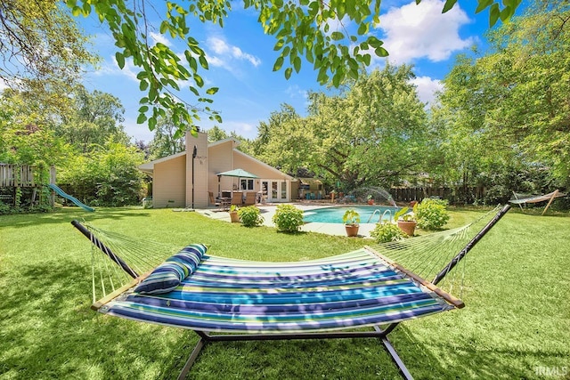 1760 Grant St, Elkhart, IN 46514 - view of yard with a patio area, french doors, a playground, and view of scattered trees
