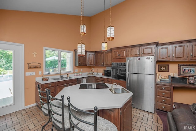 1760 Grant St, Elkhart, IN 46514 - kitchen featuring black appliances, high vaulted ceiling, brick patterned flooring, a breakfast bar, and a kitchen island
