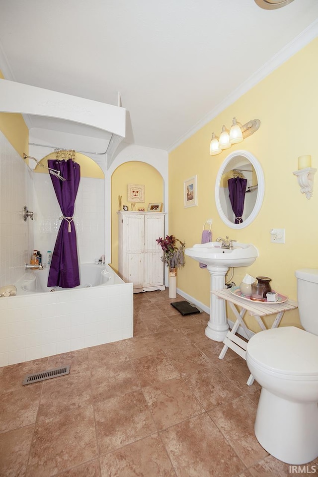 1760 Grant St, Elkhart, IN 46514 - full bathroom featuring ornamental molding and tiled shower / bath combo