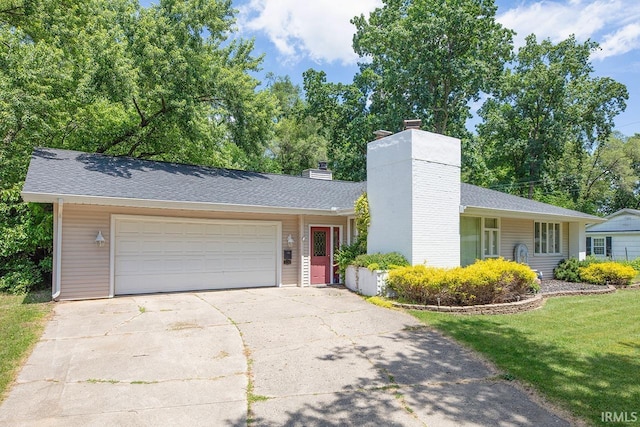 1760 Grant St, Elkhart, IN 46514 - view of front of property featuring a chimney, driveway, a garage, a shingled roof, and a front lawn