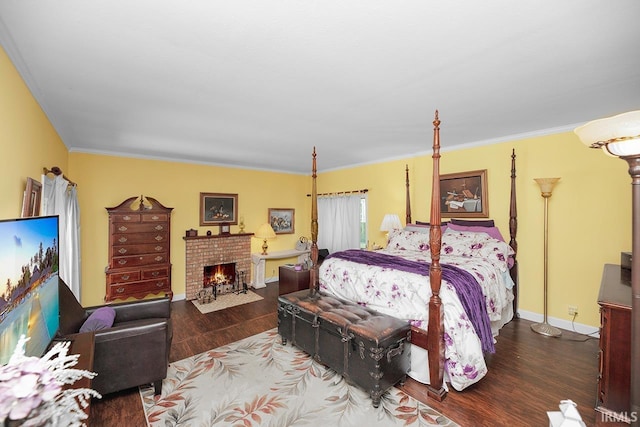 1760 Grant St, Elkhart, IN 46514 - bedroom featuring wood finished floors, ornamental molding, and a brick fireplace