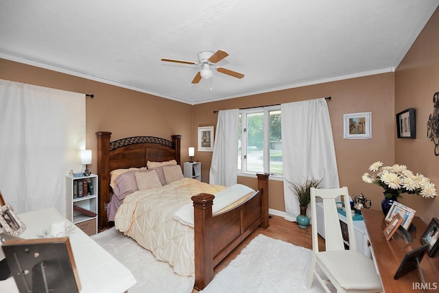 1760 Grant St, Elkhart, IN 46514 - bedroom featuring crown molding, a ceiling fan, and light wood-type flooring