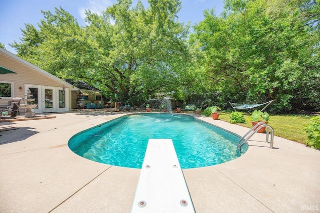 1760 Grant St, Elkhart, IN 46514 - swimming pool featuring a patio area, a diving board, and french doors