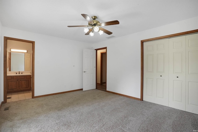 741 Christopher Dr, Evansville, IN 47711 - unfurnished bedroom with light colored carpet, a closet, ceiling fan, and ensuite bathroom