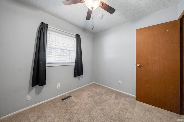 6701 Bittersweet Dr, Fort Wayne, IN 46825 - carpeted spare room featuring a ceiling fan and a textured ceiling