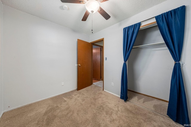 6701 Bittersweet Dr, Fort Wayne, IN 46825 - unfurnished bedroom with carpet floors, a closet, a ceiling fan, and a textured ceiling