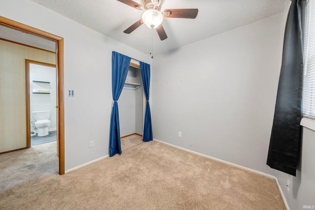 6701 Bittersweet Dr, Fort Wayne, IN 46825 - unfurnished bedroom featuring carpet flooring, a closet, a textured ceiling, and a ceiling fan