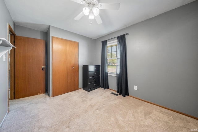 6701 Bittersweet Dr, Fort Wayne, IN 46825 - unfurnished bedroom with light carpet, a closet, and a ceiling fan
