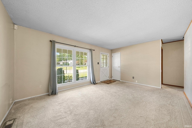 6701 Bittersweet Dr, Fort Wayne, IN 46825 - empty room with a textured ceiling and carpet floors