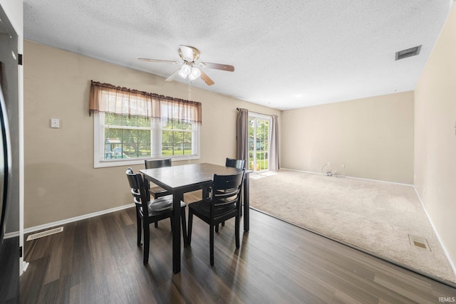 6701 Bittersweet Dr, Fort Wayne, IN 46825 - dining room with a ceiling fan, a textured ceiling, and dark wood-style flooring