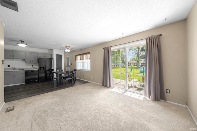 6701 Bittersweet Dr, Fort Wayne, IN 46825 - carpeted living area with baseboards and a ceiling fan