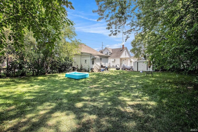 517 S Kaley St, South Bend, IN 46619 - view of green lawn featuring a shed