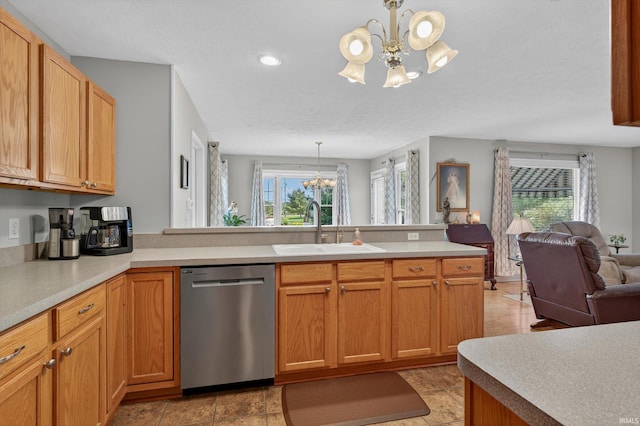 5506 Getty Ct, Granger, IN 46530 - kitchen featuring dishwasher, a chandelier, open floor plan, a peninsula, and plenty of natural light