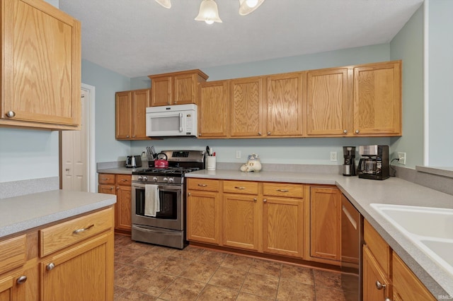 5506 Getty Ct, Granger, IN 46530 - kitchen with stainless steel appliances and light countertops