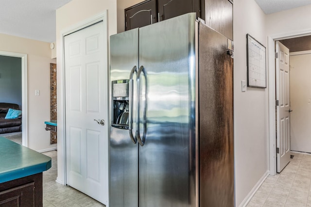 10414 Unita Dr, Fort Wayne, IN 46804 - kitchen with stainless steel fridge and dark brown cabinets