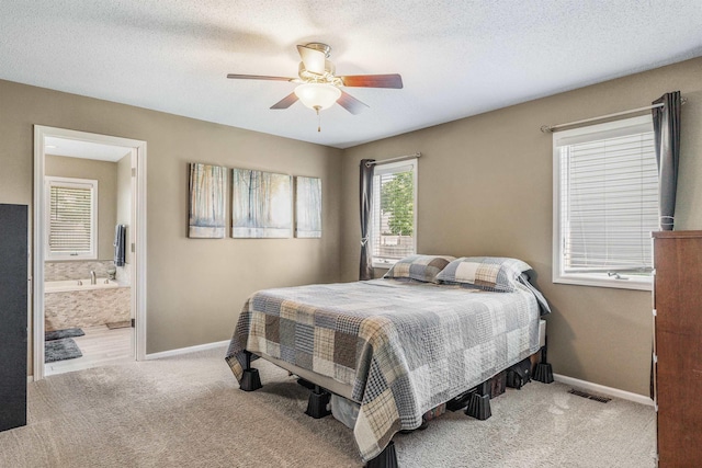 10414 Unita Dr, Fort Wayne, IN 46804 - bedroom with carpet flooring, connected bathroom, and ceiling fan