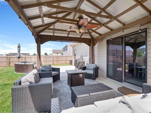 2479 Trillium Cv, Huntertown, IN 46748 - fenced backyard featuring an outdoor living space, a gazebo, ceiling fan, and a patio