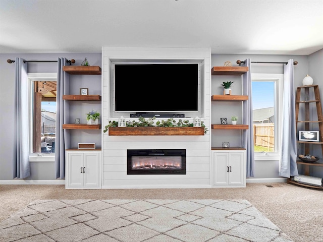 2479 Trillium Cv, Huntertown, IN 46748 - unfurnished living room with carpet and a large fireplace
