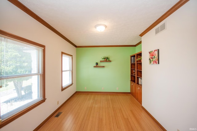 3827 Sunnycroft Pl, West Lafayette, IN 47906 - unfurnished room with light wood-style floors, ornamental molding, and a textured ceiling