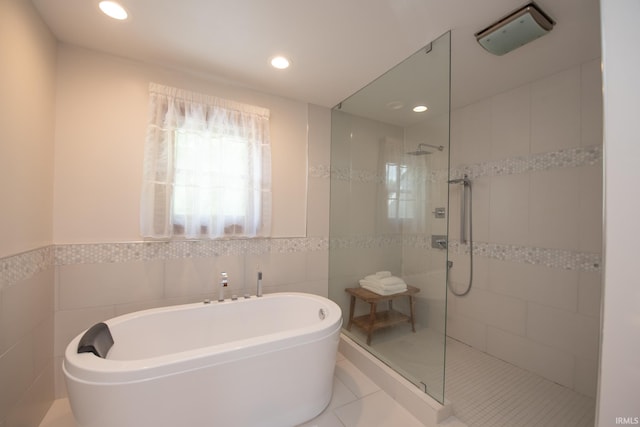 3827 Sunnycroft Pl, West Lafayette, IN 47906 - full bathroom featuring a soaking tub, a walk in shower, tile walls, tile patterned flooring, and recessed lighting